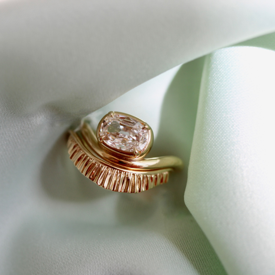 white elongated cushion cut diamond ring